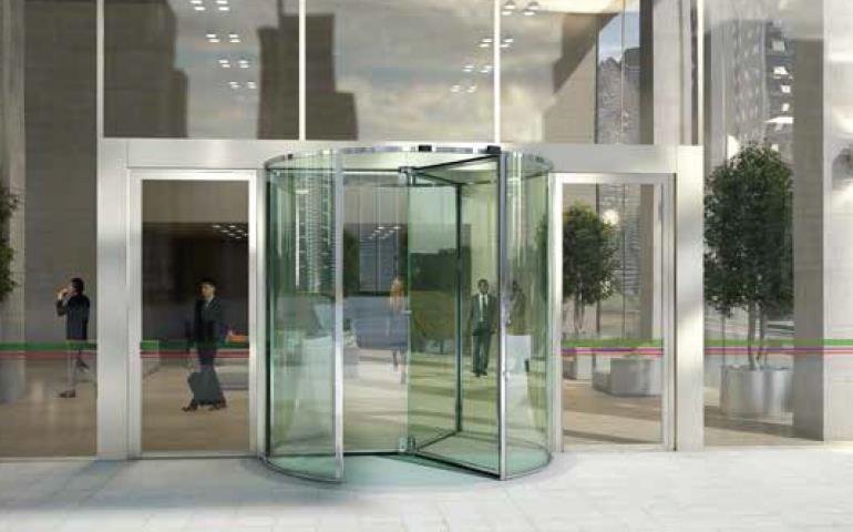 Revolving glass door system
